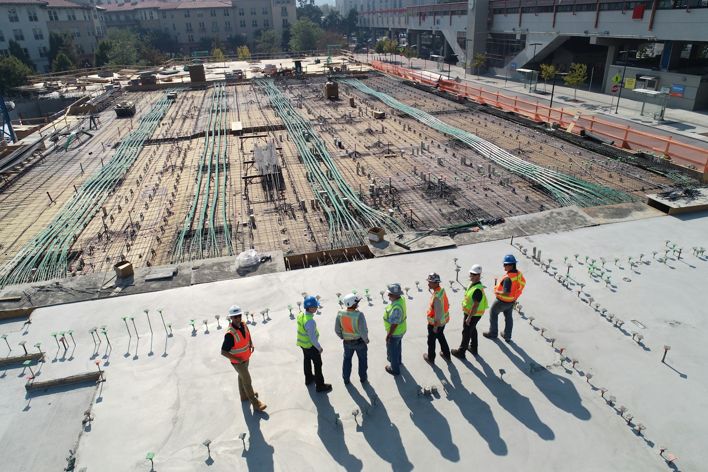 Construction professionals collaborating on technical work